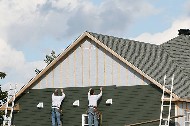 Professional Storm Damage Siding Repair technician working in East Walpole, MA
